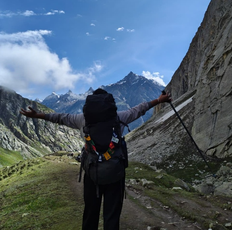 Yash Srivastava on a mountain trek with arms wide open